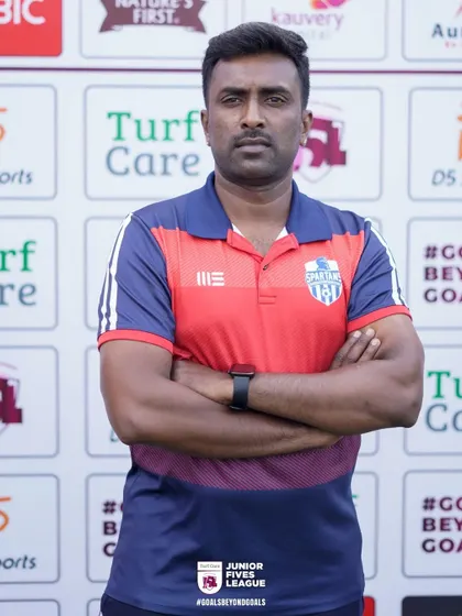 A coach from Spartans Football Academy, showing the pride and focus that defines our participating teams.
