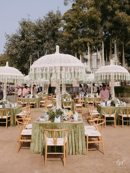 The overall seating arrangement for a lunch event, where each table was adorned with personalized, humorous cards, making the entire space feel unique.