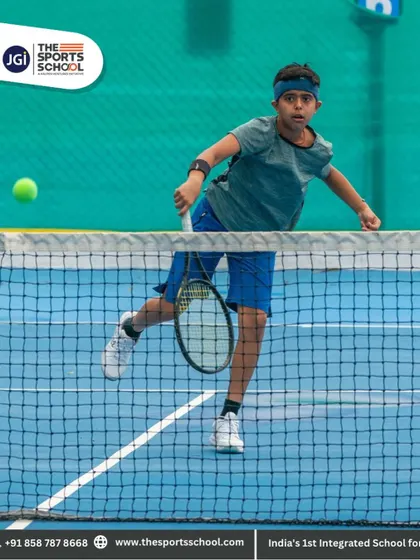 A player lunges for a volley at the net, demonstrating the agility and quick reflexes required in tennis.