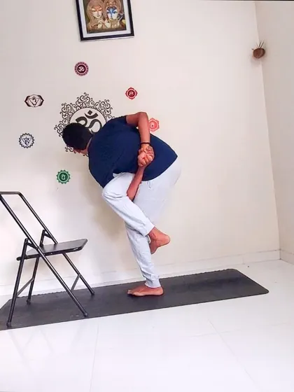 Here I demonstrate a variation of Parivrtta Svarga Dvijasana, the Revolved Bird of Paradise Pose, using a chair for support. This shows how props can be used to safely work towards advanced postures involving deep twists and balance.