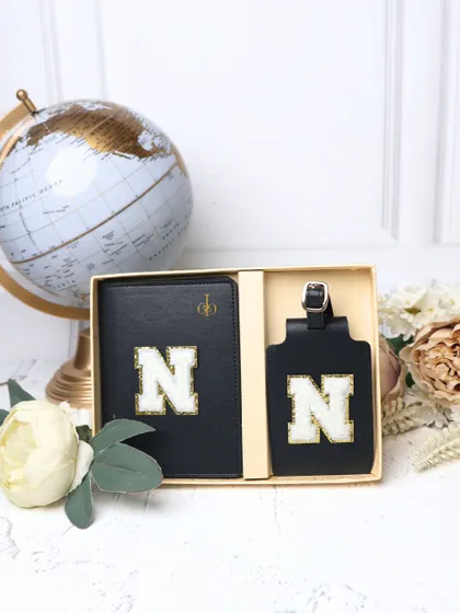 Another look at the personalized black passport cover and luggage tag set. It's the perfect gift for a frequent traveler who values both style and function.