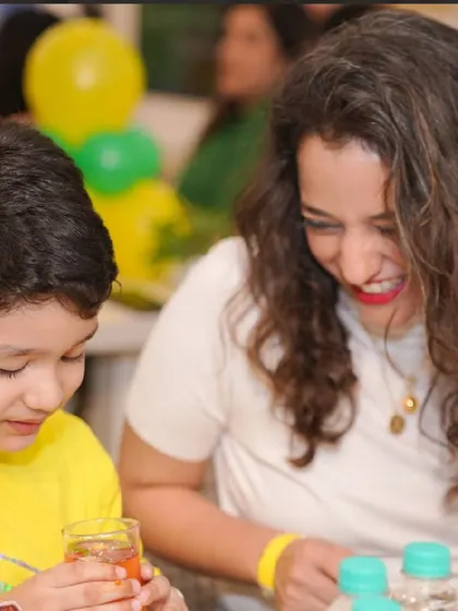 A mother shares a laugh with her child, a precious, candid moment made possible when you're not worried about party logistics.