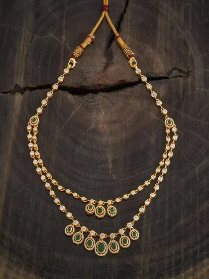 A beautiful two-layer necklace featuring green and white stones. This piece offers a delicate, layered look that is both modern and traditionally inspired, perfect for pairing with a variety of necklines.