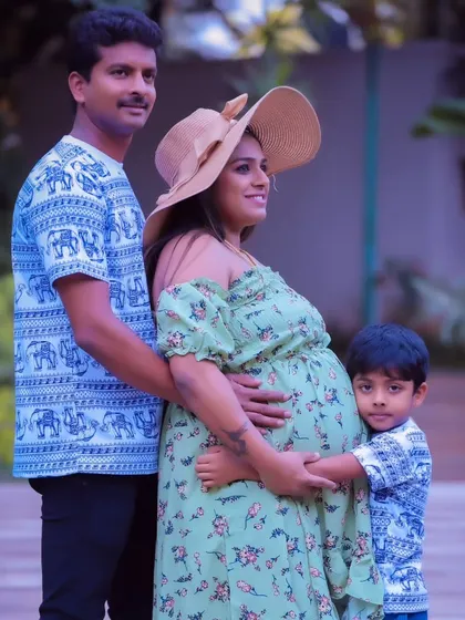 A casual and sweet family maternity shoot, with the whole family in matching elephant-print outfits.