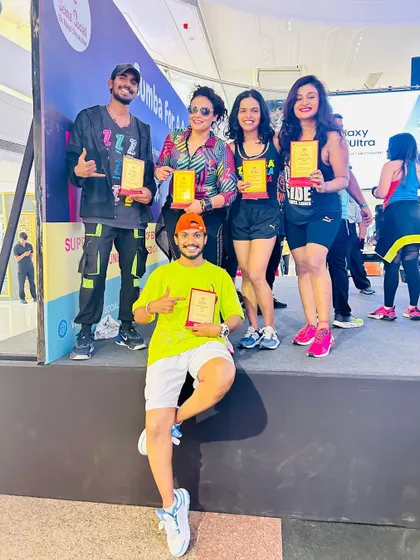 Another shot with my fellow instructors, proudly holding our awards. It was a day filled with dance, joy, and giving back.