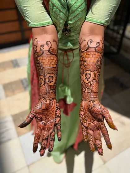 Another angle of the sun-kissed bridal stain, highlighting the intricate peacock and floral patterns.