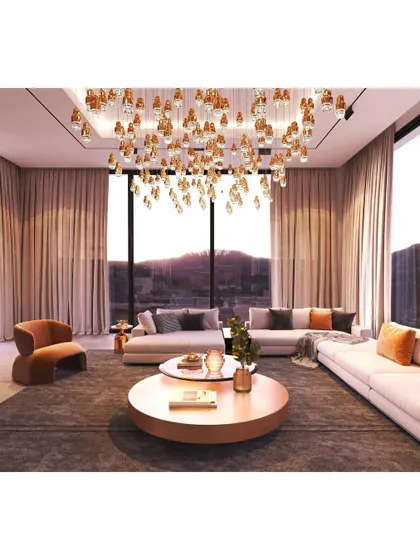 This living room is all about high-impact luxury. A custom cascading crystal chandelier hangs like a piece of art, reflecting light and creating a breathtaking focal point in this modern space.