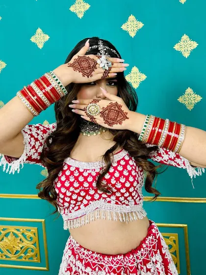 A model showcasing a modern, geometric design for a bridal look. The sharp, clean lines of the diamond-shaped pattern are perfect for a contemporary bride.