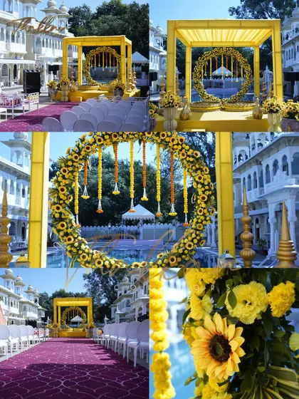 A beautiful poolside Haldi mandap setup. The decor features a square yellow structure with a circular sunflower arch inside, creating a stunning visual against the backdrop of a heritage-style building.