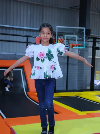 Finding balance and having a blast. The simple joy of bouncing on a trampoline is a timeless childhood pleasure that we love to provide.