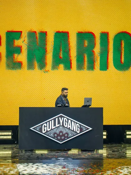 On the decks representing Gully Gang at the YouTube FanFest. This shot captures me in my element, focused on the music and the moment, with the iconic Gully Gang logo backing me up.