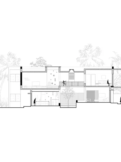 A sectional drawing of the Aayi House, illustrating how the main living spaces are elevated on the first floor to capture breezes and views. The diagram also shows the central courtyard that brings light and ventilation into the heart of the home.