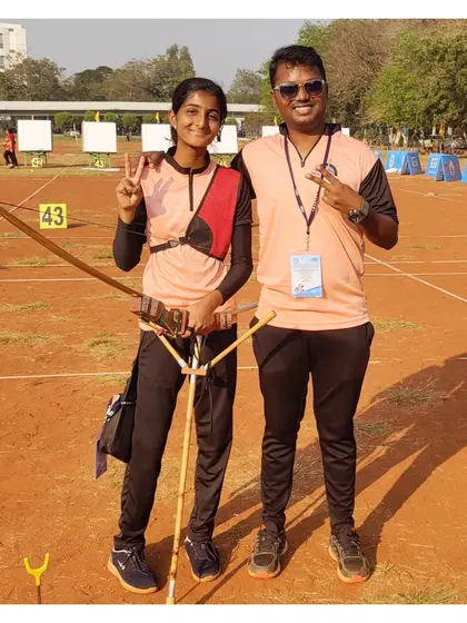 A victory pose with one of our students after she won a team gold medal at the National Archery Championship in Vijayawada.