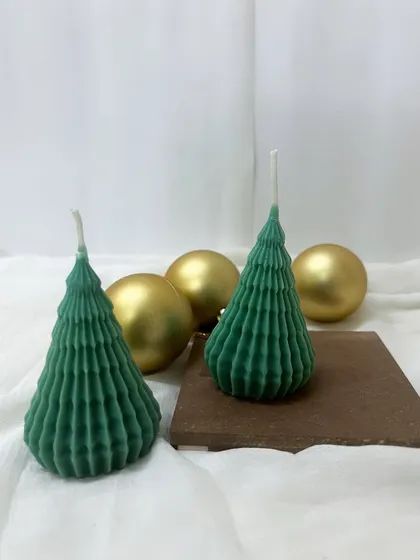 Happy Christmas! Our green spiky tree candles are ready to light up your holiday decor.