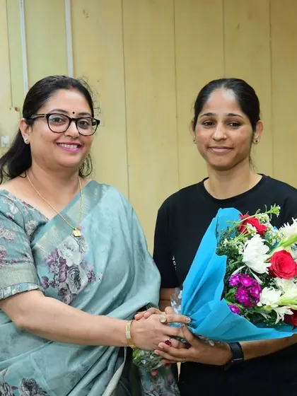Another of my dedicated female instructors receiving flowers at the CCS University event. The respect shown to my team is a reflection of the important work they do.