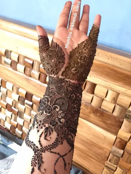 The full view of the cutwork design, showing how the pattern extends down the arm.