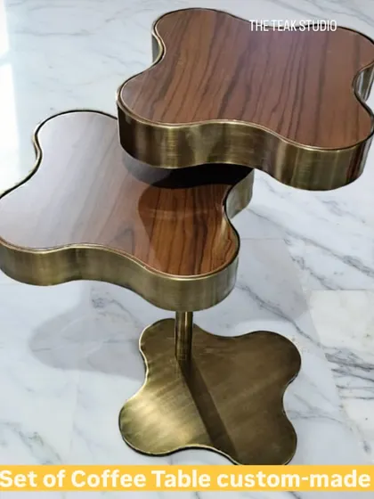 A top-down view of the custom-made clover coffee table set. This angle showcases the unique shape and the beautiful reflection on the polished walnut surfaces, making it a true conversation starter.