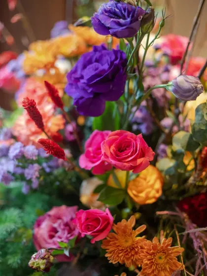 Another beautiful close-up of the vibrant florals, showcasing the rich textures and colors that define this arrangement. Every bloom is carefully chosen to contribute to the overall symphony of color.