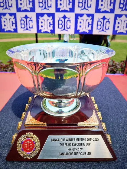 The Press Reporters Cup, a classic silver bowl awarded to the winner of this special race.