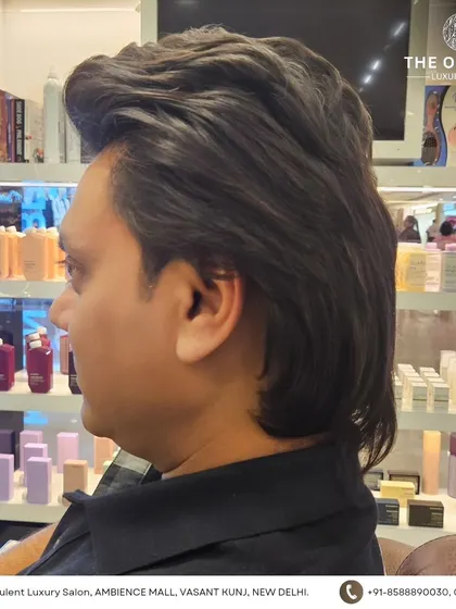 A side profile of this voluminous men's hairstyle. It's a great option for those who prefer to keep some length.