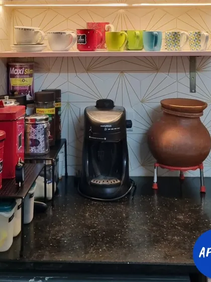 Before, this kitchen counter was cluttered and unusable. By using shelf risers to optimize vertical height, we created a clean, organized coffee and tea station.