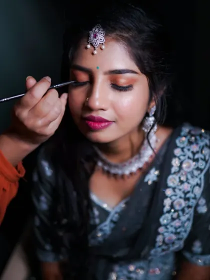 Precision is key for a look that stands out on camera. Here's a behind the scenes moment of me carefully applying eyeliner to create a sharp, defined eye, a crucial step for a polished and professional photoshoot makeup finish.