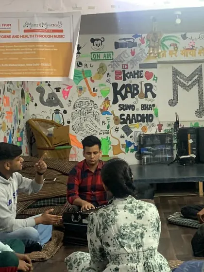 A vocal class engages in a discussion, showing that our sessions are not just about singing but also about understanding the meaning and emotion behind the music.