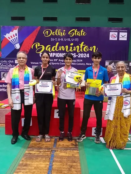 Three of my players after receiving their medals at the Delhi State Championships. Each certificate represents a new milestone in their badminton journey.