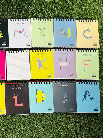 More of the pocket notepad collection, showcasing the variety of bright colors and quirky animal designs.