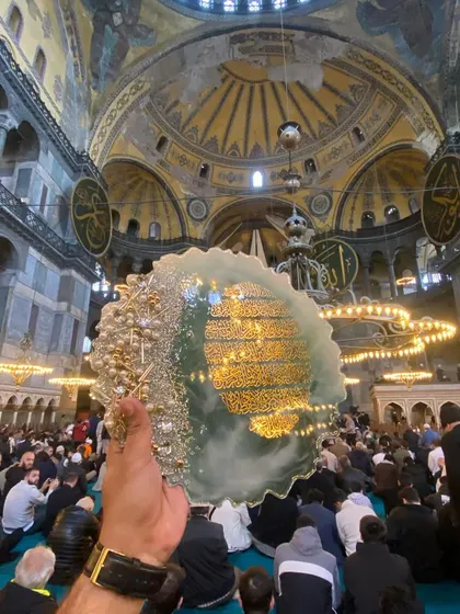 A moment of reflection inside Hagia Sophia, with my resin art piece featuring Ayat al-Kursi. The light from the grand chandeliers illuminates the artwork, creating a magical connection between the art and the space.