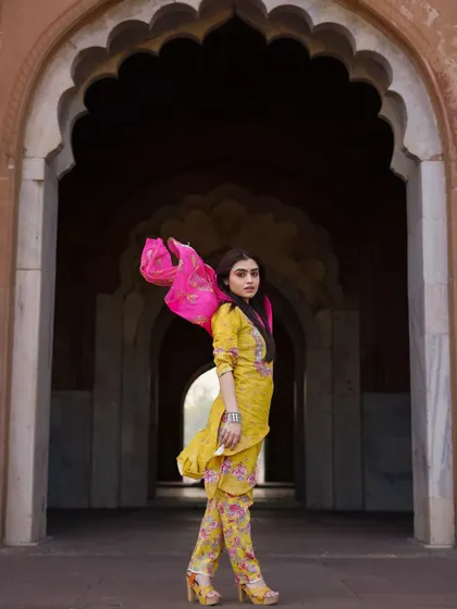 The flow and color of this ethnic outfit come alive against the historic arches. I focus on capturing movement to bring energy to fashion shoots, making the clothing feel dynamic and vibrant. This is a great example of a fashion portrait for an ethnic wear brand.