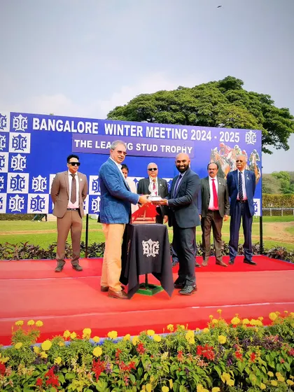Mr. Zeyn Mirza of Kunigal Stud Farm presents The Leading Stud Trophy to the connections of N R I Ace.