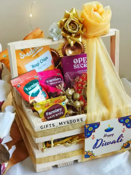 Another angle of the decorated wooden crate hamper, showing the 'Happy Diwali' tag. It's a rustic and charming option for corporate gifting.