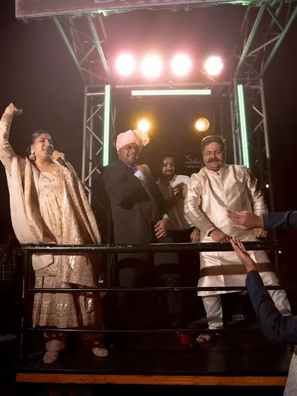 Cheering on the baraatis from the truck. My enthusiasm is a key ingredient in making the baraat a high point of the wedding.