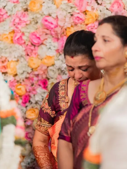 Another candid shot of the bride's mother during the ceremony. Her makeup looks natural and elegant, holding up beautifully through the emotional moments.