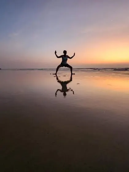 If you are an Absolute Yoga student, you will inevitably strike a pose on the beach. Here is another student making us proud with a beautiful Goddess Pose against a sunset.