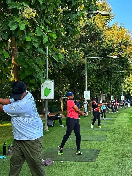 Golfers in mid swing, showcasing the variety of players who enjoy our facilities. The focus is on the action and the community.