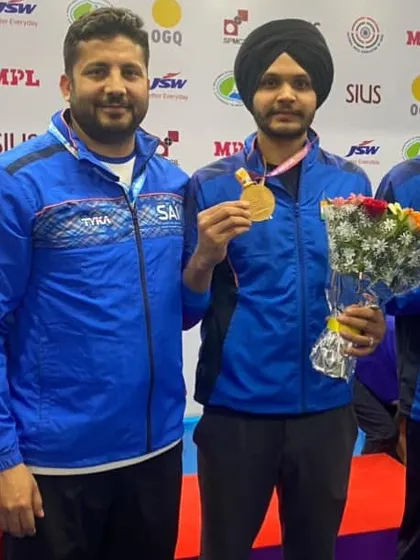 A proud moment with my student Sarabjot Singh after a medal win. My role as a coach is to guide and support my shooters through every step of their journey to the top.