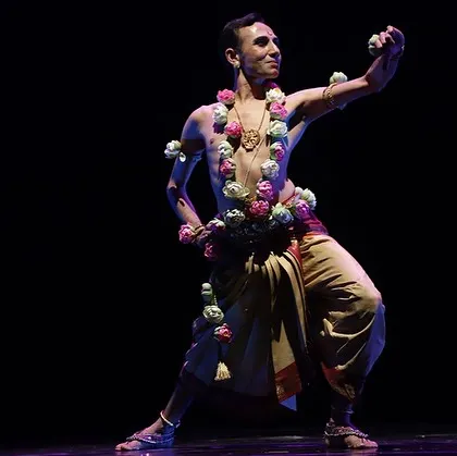 A powerful pose from "Ṛtu Vismruthi," where I am adorned with a garland of flowers, symbolizing my connection to nature, a central theme of the production.