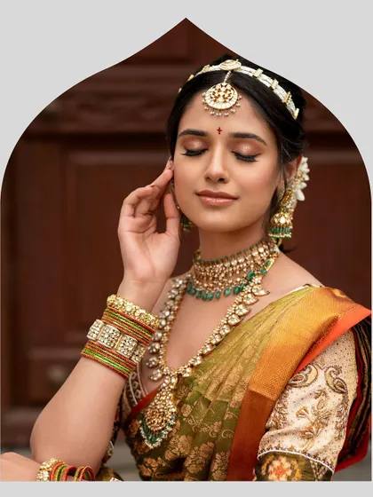 A duplicate image showing a serene moment, capturing the bride's elegant profile and the intricate details of her jewelry and custom-embroidered blouse.