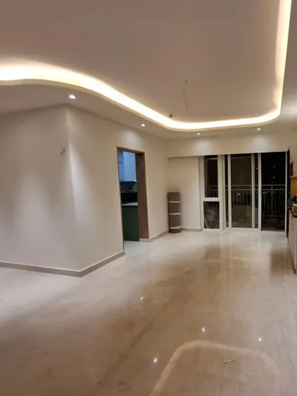Designing with the "flow". Another angle of the space, showing the polished floors and how the curved ceiling lights guide you through the home.