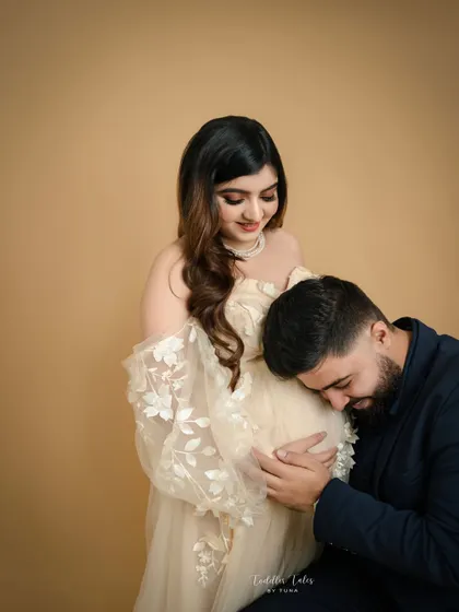 Listening to the future. This classic pose of the partner listening to the baby bump is always filled with so much emotion and sweet anticipation.