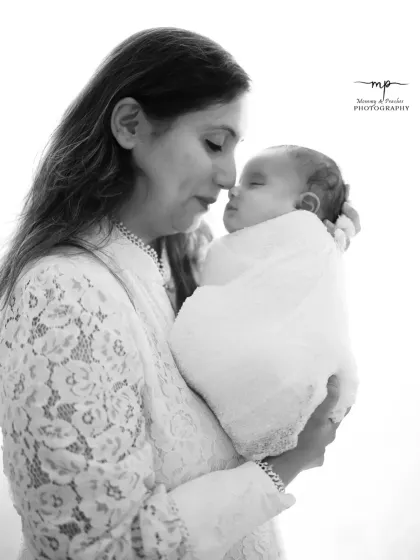 A timeless black and white portrait of a mother and her newborn. The simplicity of monochrome beautifully highlights their connection.