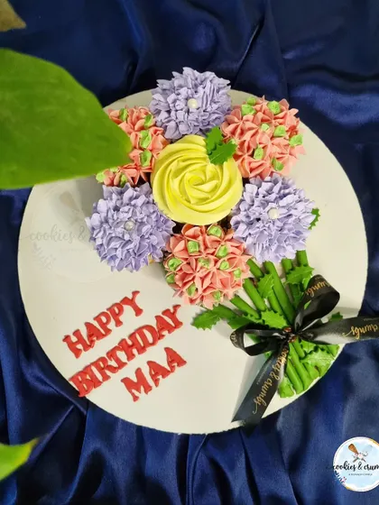 My special cupcake bouquets are a unique way to gift flowers and cake at the same time. This beautiful arrangement features a variety of piped flowers in different colors.