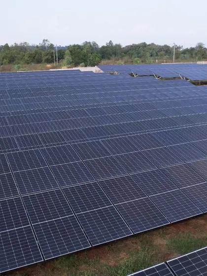 This close-up aerial view highlights the precision and density of our solar panel arrays in a 1.3 MW project. Our engineering ensures optimal land use and energy output for every utility-scale solar farm we build.