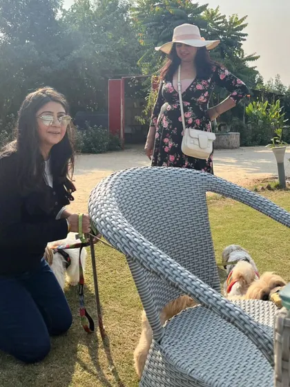 A candid moment between a guest and her pets. Our relaxed environment is perfect for spending quality time with your furry family.