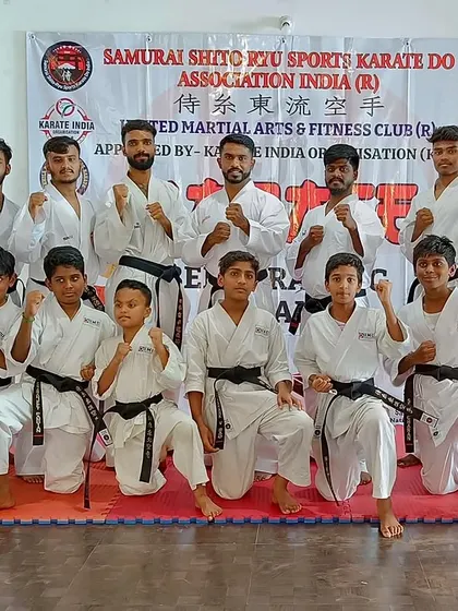 The team of newly graded black belts and their senior instructors.