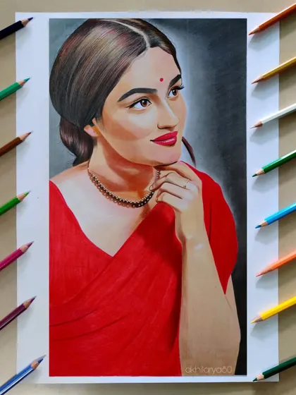This is a paid commission of the beautiful actress Prayaga Martin. It was a pleasure to draw her in this classic red saree using colored pencils on A3 paper.