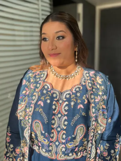 The sun-kissed glow enhances her features beautifully.