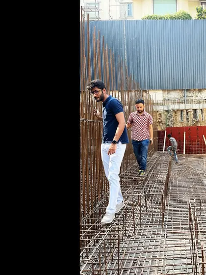 My team members walking through the grid of rebar before the concrete is poured for a floor slab. This illustrates the complex engineering that underpins the simple appearance of the final structure.